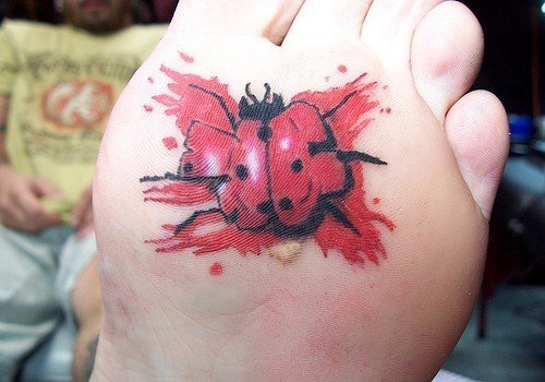 Ladybug tattoo on the ankle