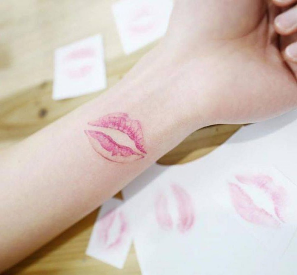 Red Ink Lip Print Tattoo On Left Side Neck