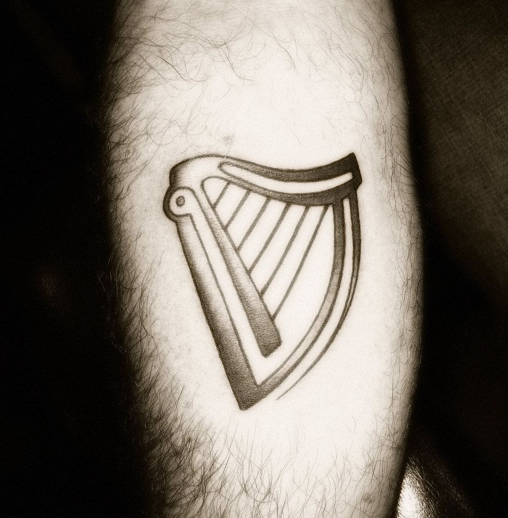 Guinness Harp tattoo  Irish harp tattoo Irish tattoos Tribal sleeve  tattoos